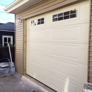 It indicates the beautiful white coloured garage door
replacement